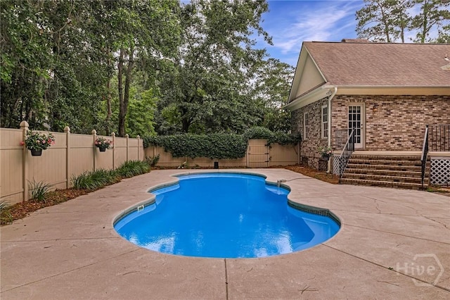 10 Cedar View Dr, Savannah, GA 31410 - view of swimming pool featuring a fenced backyard, a patio, and a deck