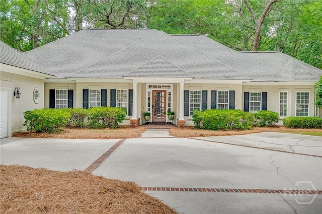 14 Black Hawk Trl, Savannah, GA 31411 - view of front of home featuring stucco siding and a shingled roof