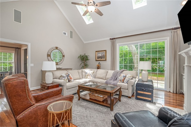 14 Black Hawk Trl, Savannah, GA 31411 - living area featuring a skylight, a ceiling fan, wood finished floors, high vaulted ceiling, and crown molding