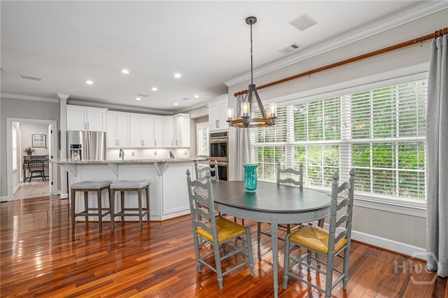 14 Black Hawk Trl, Savannah, GA 31411 - dining space with crown molding, a chandelier, baseboards, dark wood-style floors, and recessed lighting