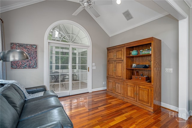 14 Black Hawk Trl, Savannah, GA 31411 - living room featuring ceiling fan, lofted ceiling, wood finished floors, baseboards, and crown molding