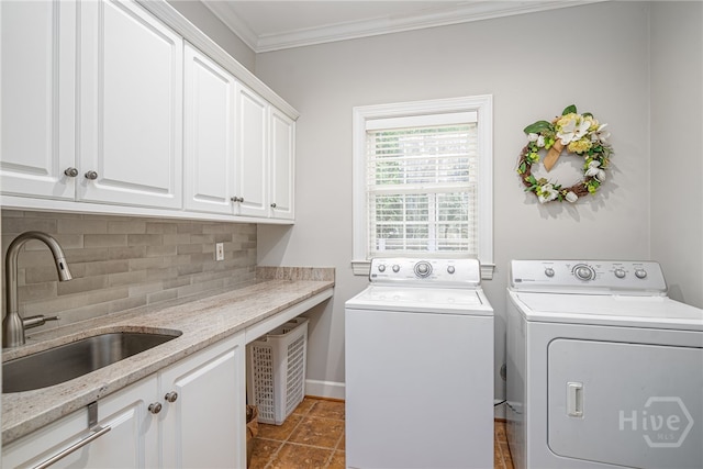 14 Black Hawk Trl, Savannah, GA 31411 - laundry area featuring washing machine and dryer, cabinet space, crown molding, and baseboards