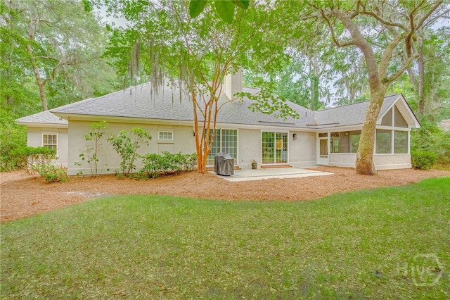 14 Black Hawk Trl, Savannah, GA 31411 - back of house featuring a patio area, stucco siding, a chimney, a sunroom, and roof with shingles