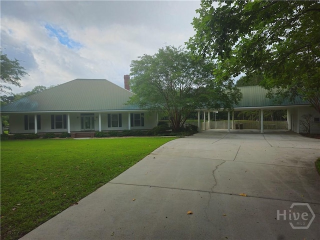 30 Fields Park Rd, Statesboro, GA 30461 - view of front of house featuring driveway, a chimney, a front yard, a carport, and metal roof