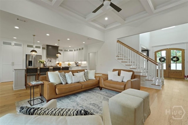 15 Reed Grass Ln, Savannah, GA 31405 - living room featuring light wood finished floors, stairway, beamed ceiling, a high ceiling, and ceiling fan