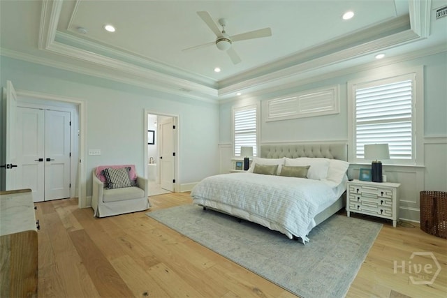 15 Reed Grass Ln, Savannah, GA 31405 - bedroom with a raised ceiling, ornamental molding, multiple windows, light wood-type flooring, and recessed lighting