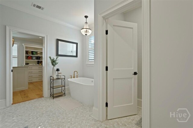 15 Reed Grass Ln, Savannah, GA 31405 - bathroom featuring a freestanding bath and crown molding
