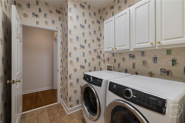 35 Wild Thistle Ln, Savannah, GA 31406 - laundry room featuring cabinet space, wallpapered walls, washer and clothes dryer, baseboards, and light tile patterned flooring