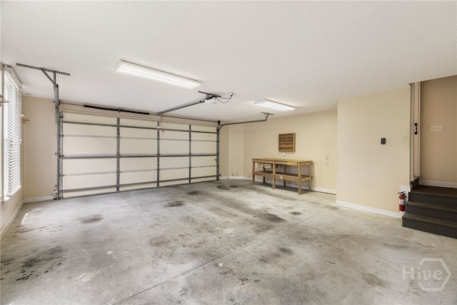 35 Wild Thistle Ln, Savannah, GA 31406 - garage featuring a garage door opener and baseboards