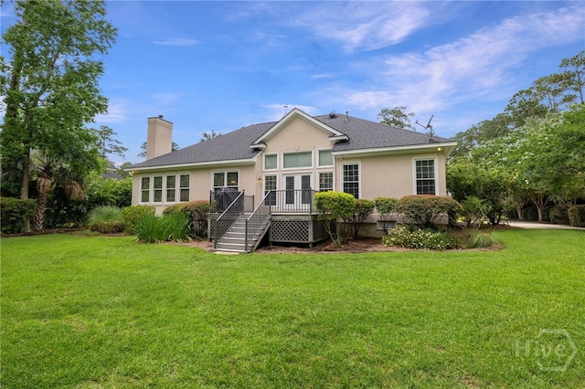 35 Wild Thistle Ln, Savannah, GA 31406 - back of property with stucco siding, a lawn, a chimney, and a deck