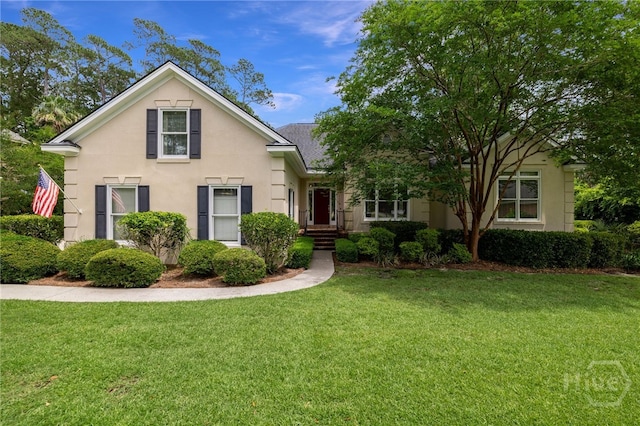 35 Wild Thistle Ln, Savannah, GA 31406 - traditional-style home featuring a front lawn and stucco siding