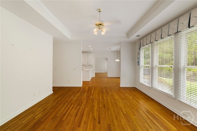 35 Wild Thistle Ln, Savannah, GA 31406 - unfurnished room with a raised ceiling, ornamental molding, baseboards, wood finished floors, and ceiling fan