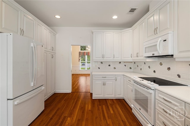 35 Wild Thistle Ln, Savannah, GA 31406 - kitchen featuring white appliances, dark wood-style floors, decorative backsplash, white cabinetry, and recessed lighting