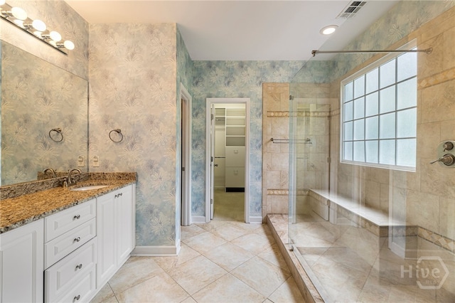 35 Wild Thistle Ln, Savannah, GA 31406 - full bathroom with a shower stall, baseboards, a spacious closet, vanity, and tile patterned flooring