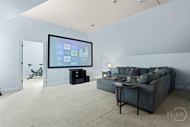 711 Chastain Cir, Richmond Hill, GA 31324 - cinema room with carpet floors, lofted ceiling, and baseboards