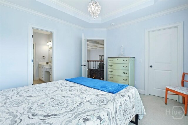 711 Chastain Cir, Richmond Hill, GA 31324 - bedroom with a chandelier, ornamental molding, light carpet, and connected bathroom