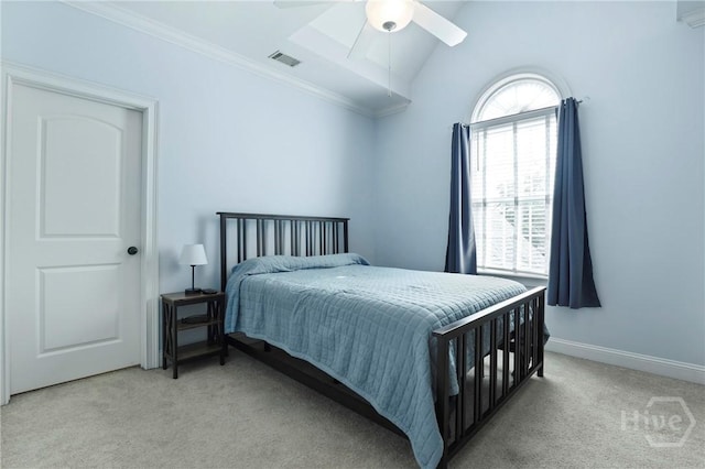 711 Chastain Cir, Richmond Hill, GA 31324 - bedroom with light colored carpet, crown molding, vaulted ceiling, a ceiling fan, and baseboards