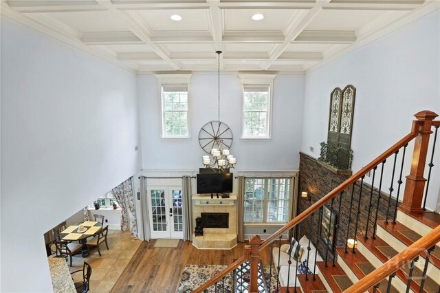711 Chastain Cir, Richmond Hill, GA 31324 - living area with a chandelier, stairs, recessed lighting, french doors, and beam ceiling