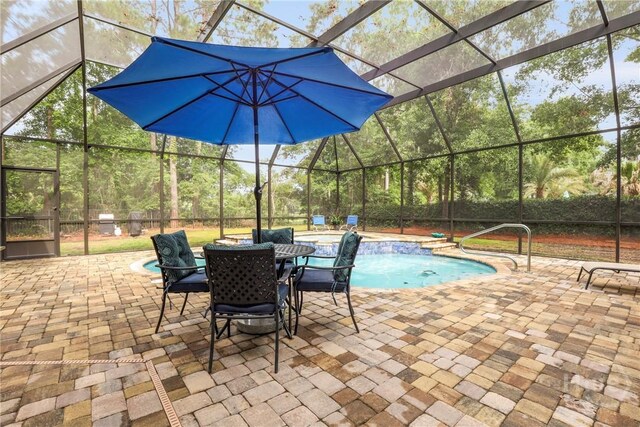 711 Chastain Cir, Richmond Hill, GA 31324 - swimming pool featuring glass enclosure and a patio area