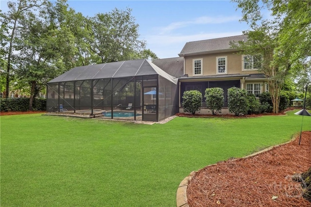 711 Chastain Cir, Richmond Hill, GA 31324 - back of property with an outdoor pool, a yard, stucco siding, and a lanai