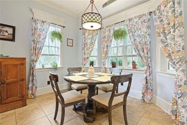 711 Chastain Cir, Richmond Hill, GA 31324 - dining area with light tile patterned floors, ornamental molding, and baseboards