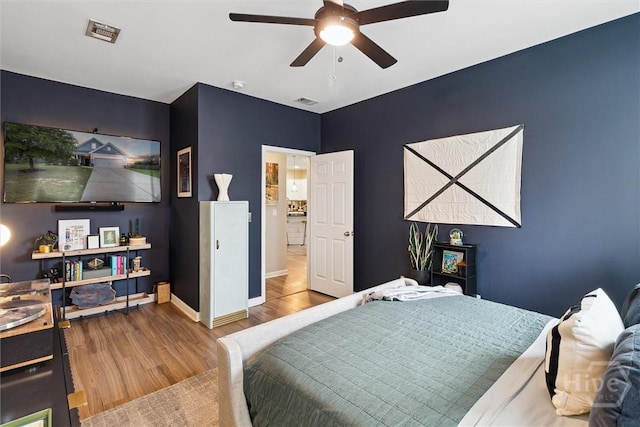 131 Tanzania Trl, Pooler, GA 31322 - bedroom with wood finished floors, baseboards, and ceiling fan