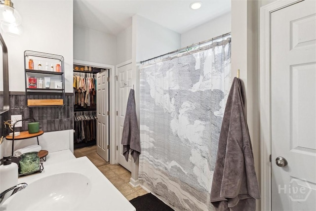 131 Tanzania Trl, Pooler, GA 31322 - full bath featuring tile patterned flooring, recessed lighting, vanity, a shower with curtain, and a walk in closet