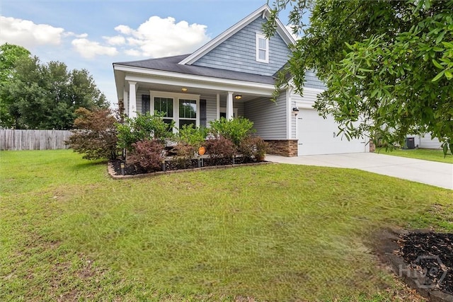131 Tanzania Trl, Pooler, GA 31322 - view of front facade with driveway, a porch, an attached garage, central AC, and stone siding