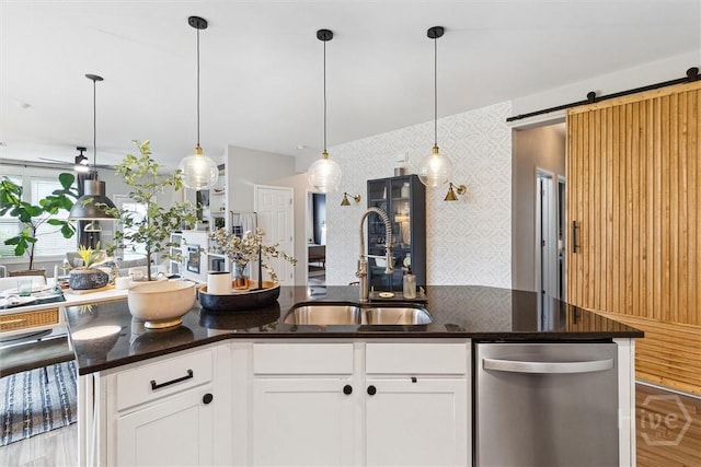 131 Tanzania Trl, Pooler, GA 31322 - kitchen with dishwasher, a sink, wallpapered walls, ceiling fan, and dark stone counters