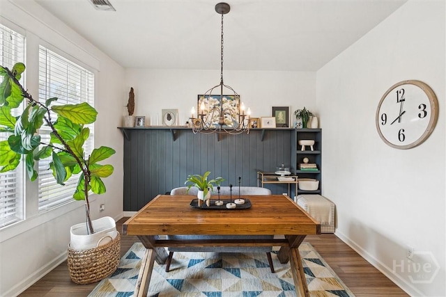 131 Tanzania Trl, Pooler, GA 31322 - dining area with a chandelier, wood finished floors, and baseboards