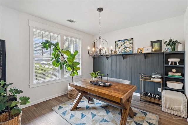 131 Tanzania Trl, Pooler, GA 31322 - dining area with a chandelier, wood finished floors, and baseboards