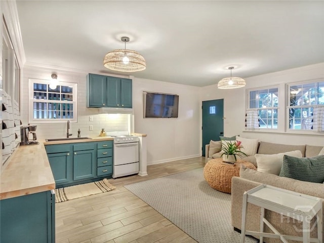 16 12th St, Tybee Island, GA 31328 - living room with light wood finished floors and baseboards