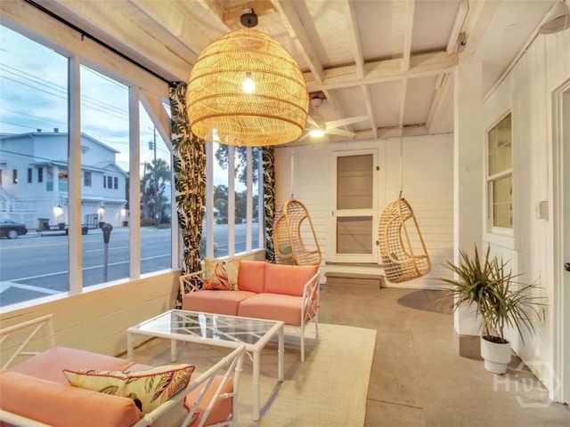 16 12th St, Tybee Island, GA 31328 - sunroom with beamed ceiling and a chandelier