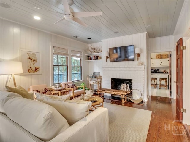 16 12th St, Tybee Island, GA 31328 - living room with wood finished floors, a fireplace, a ceiling fan, wooden ceiling, and recessed lighting