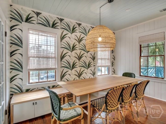16 12th St, Tybee Island, GA 31328 - dining area with healthy amount of natural light, wood finished floors, and wooden ceiling