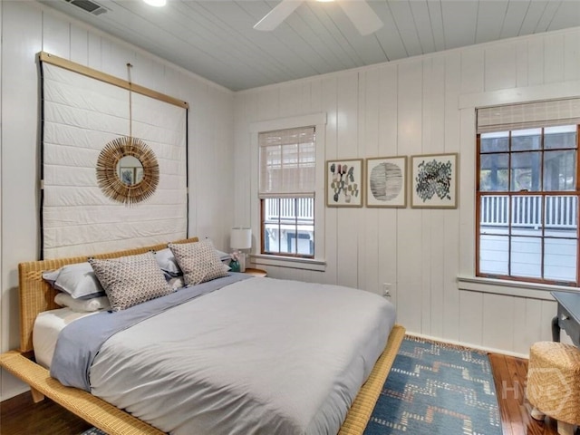 16 12th St, Tybee Island, GA 31328 - bedroom with wood finished floors, ceiling fan, and ornamental molding