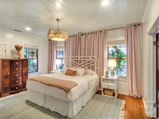 16 12th St, Tybee Island, GA 31328 - bedroom featuring a chandelier, wood finished floors, and recessed lighting