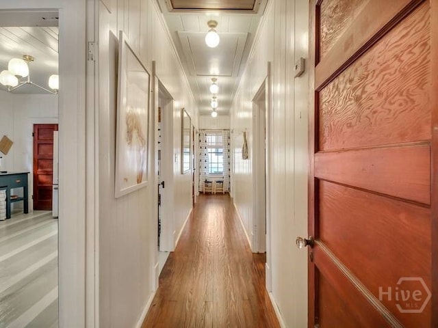 16 12th St, Tybee Island, GA 31328 - hallway with wood finished floors and attic access