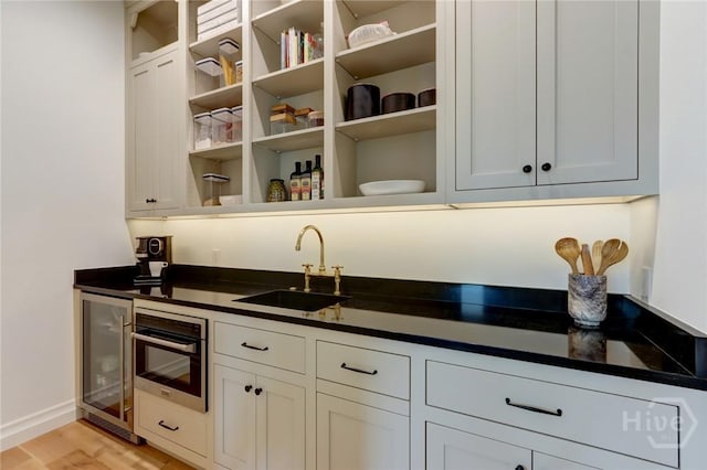 217 John Wesley Way, Savannah, GA 31404 - indoor wet bar with wine cooler, oven, light wood-type flooring, and baseboards