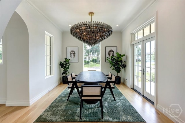 217 John Wesley Way, Savannah, GA 31404 - dining space featuring french doors, plenty of natural light, arched walkways, ornamental molding, and recessed lighting