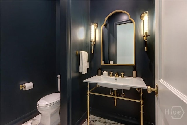 217 John Wesley Way, Savannah, GA 31404 - half bathroom with marble finish floors, toilet, baseboards, and a sink