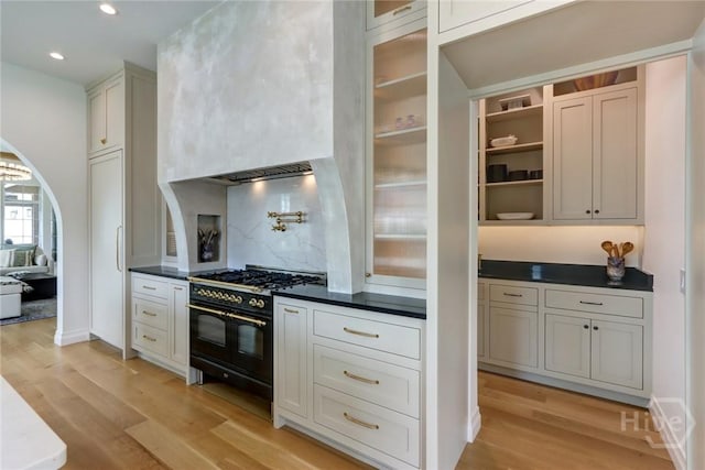 217 John Wesley Way, Savannah, GA 31404 - kitchen featuring range with two ovens, light wood-type flooring, dark countertops, and recessed lighting