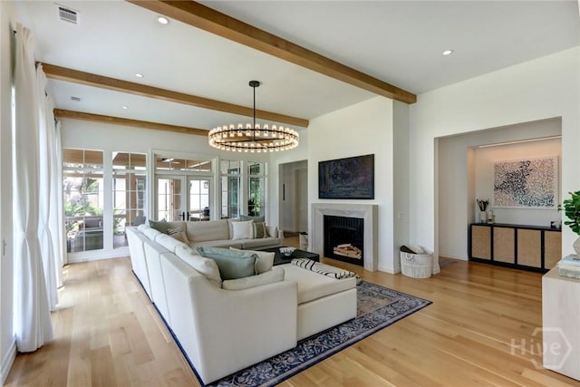 217 John Wesley Way, Savannah, GA 31404 - living room with beam ceiling, light wood-style flooring, a fireplace, a chandelier, and recessed lighting