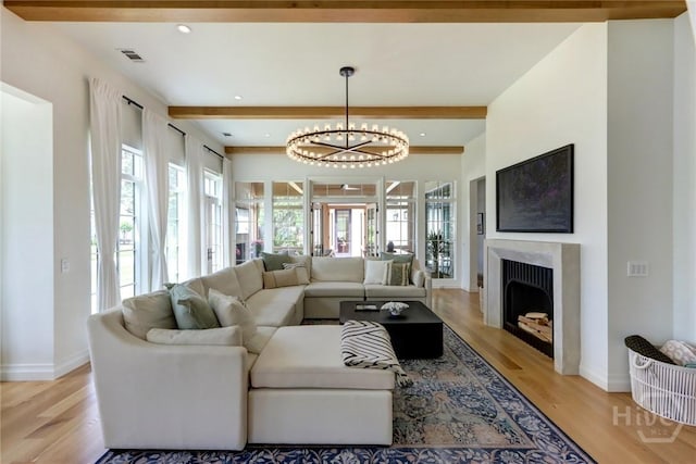 217 John Wesley Way, Savannah, GA 31404 - living area with beam ceiling, light wood-style flooring, baseboards, a chandelier, and recessed lighting
