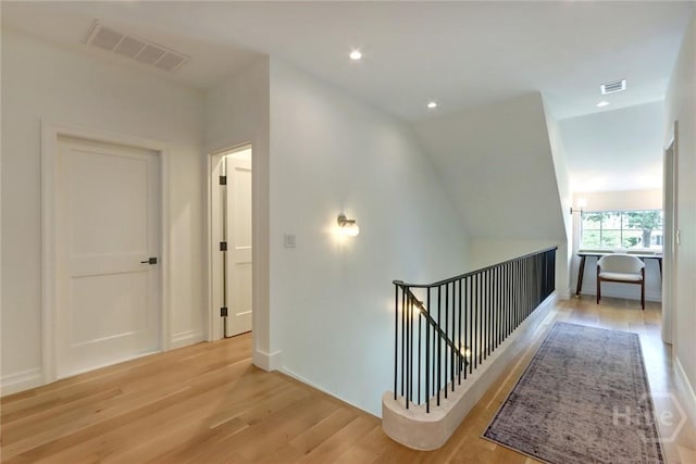 217 John Wesley Way, Savannah, GA 31404 - hallway with an upstairs landing, wood finished floors, recessed lighting, and baseboards