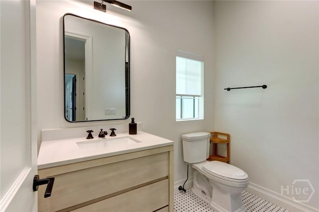 217 John Wesley Way, Savannah, GA 31404 - bathroom with toilet, baseboards, and vanity