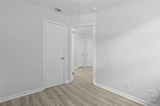 2030 E 42nd St, Savannah, GA 31404 - spare room featuring wood finished floors, baseboards, and a smoke detector