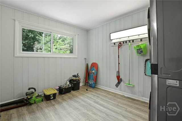 2030 E 42nd St, Savannah, GA 31404 - spare room featuring estacked washer and dryer, wood finished floors, and baseboards