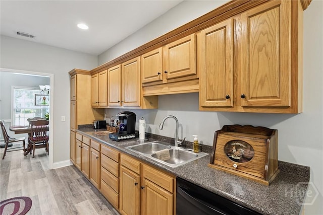 133 Cobbleton Dr, Rincon, GA 31326 - kitchen with a sink, dark countertops, light wood-style floors, black dishwasher, and recessed lighting