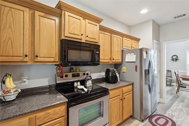 133 Cobbleton Dr, Rincon, GA 31326 - kitchen with stainless steel appliances, light wood finished floors, recessed lighting, and dark stone countertops